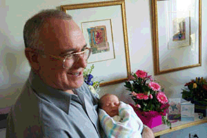 Andrew Gunn holds his new grandson Andrew Gunn holds his new grandson